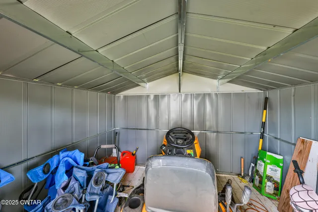 a bedroom with furniture and a chandelier