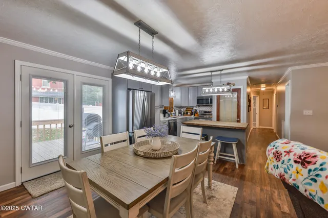 a dining room with furniture and window