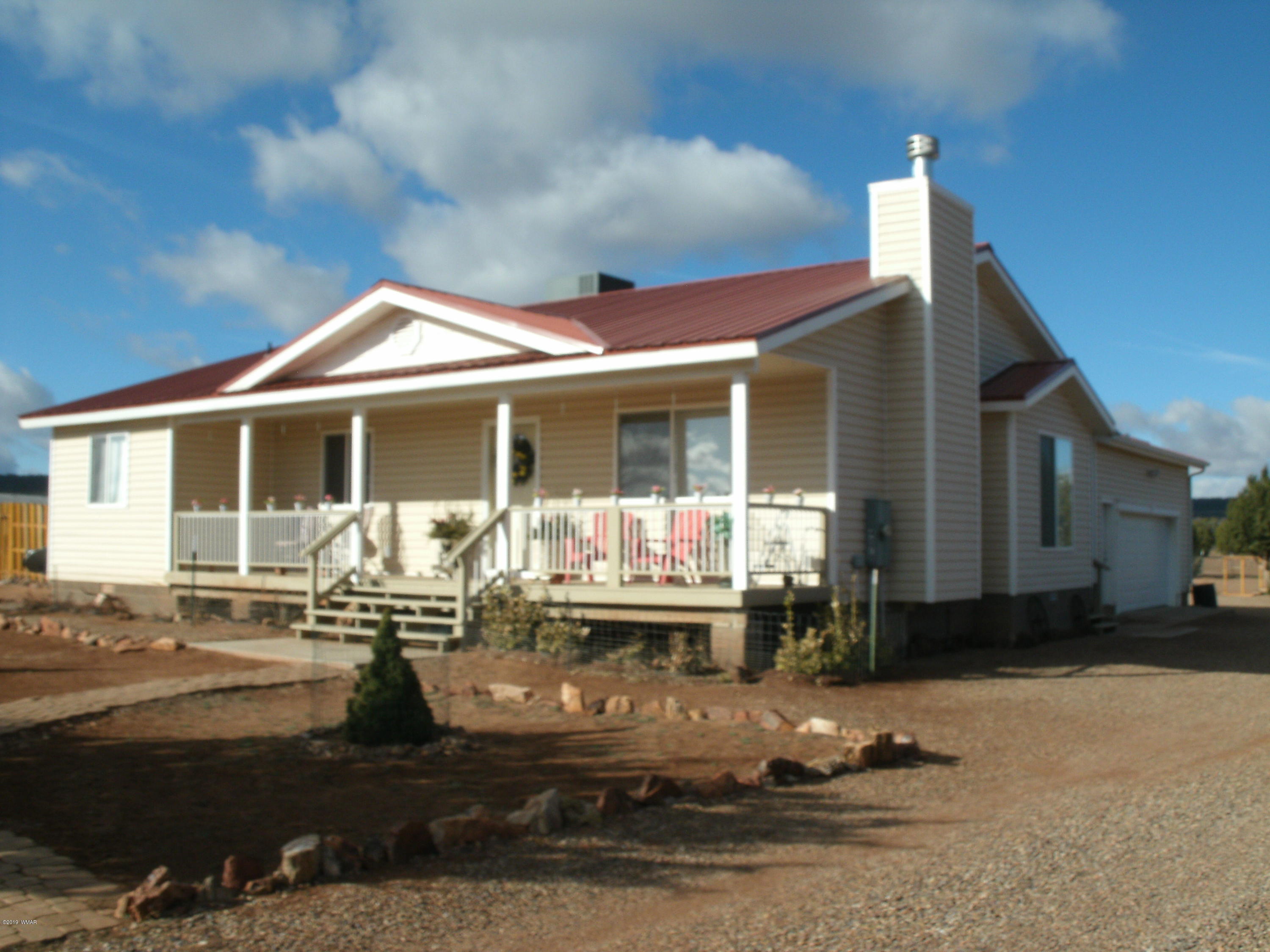4078 East Pinto Road Snowflake, AZ 85937 - Photo 1 of 49 a front view of a house with sitting area