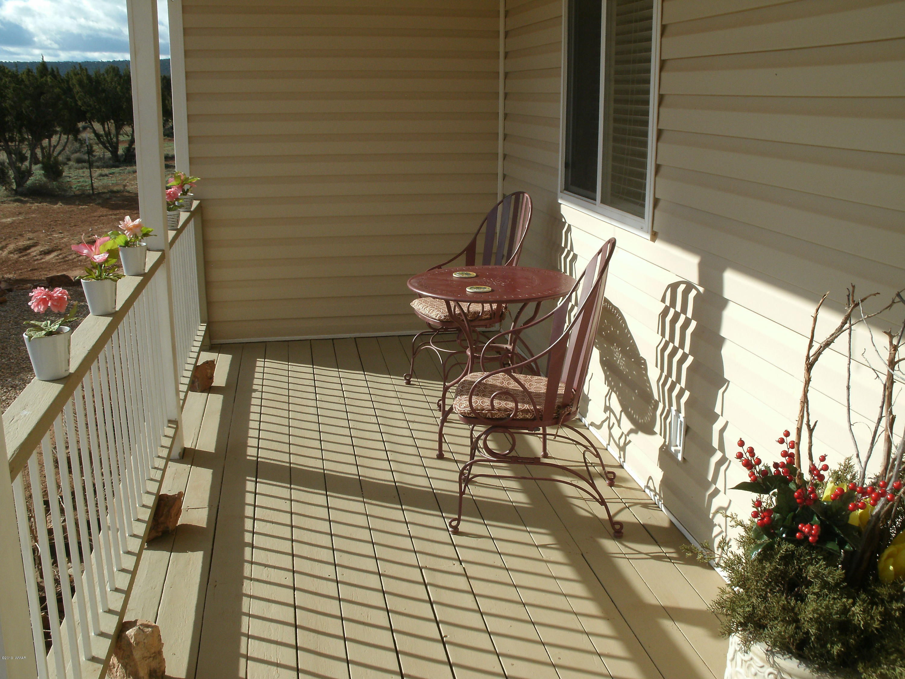 4078 East Pinto Road Snowflake, AZ 85937 - Photo 11 of 49 a view of patio with table and chairs and potted plants