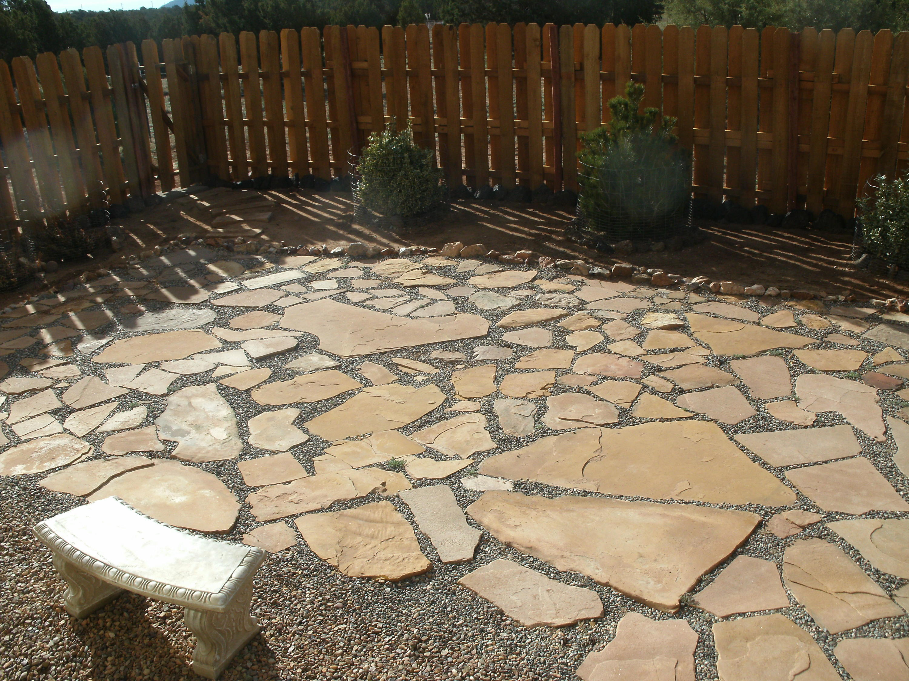 4078 East Pinto Road Snowflake, AZ 85937 - Photo 12 of 49 a backyard of a house with lots of green space and trees