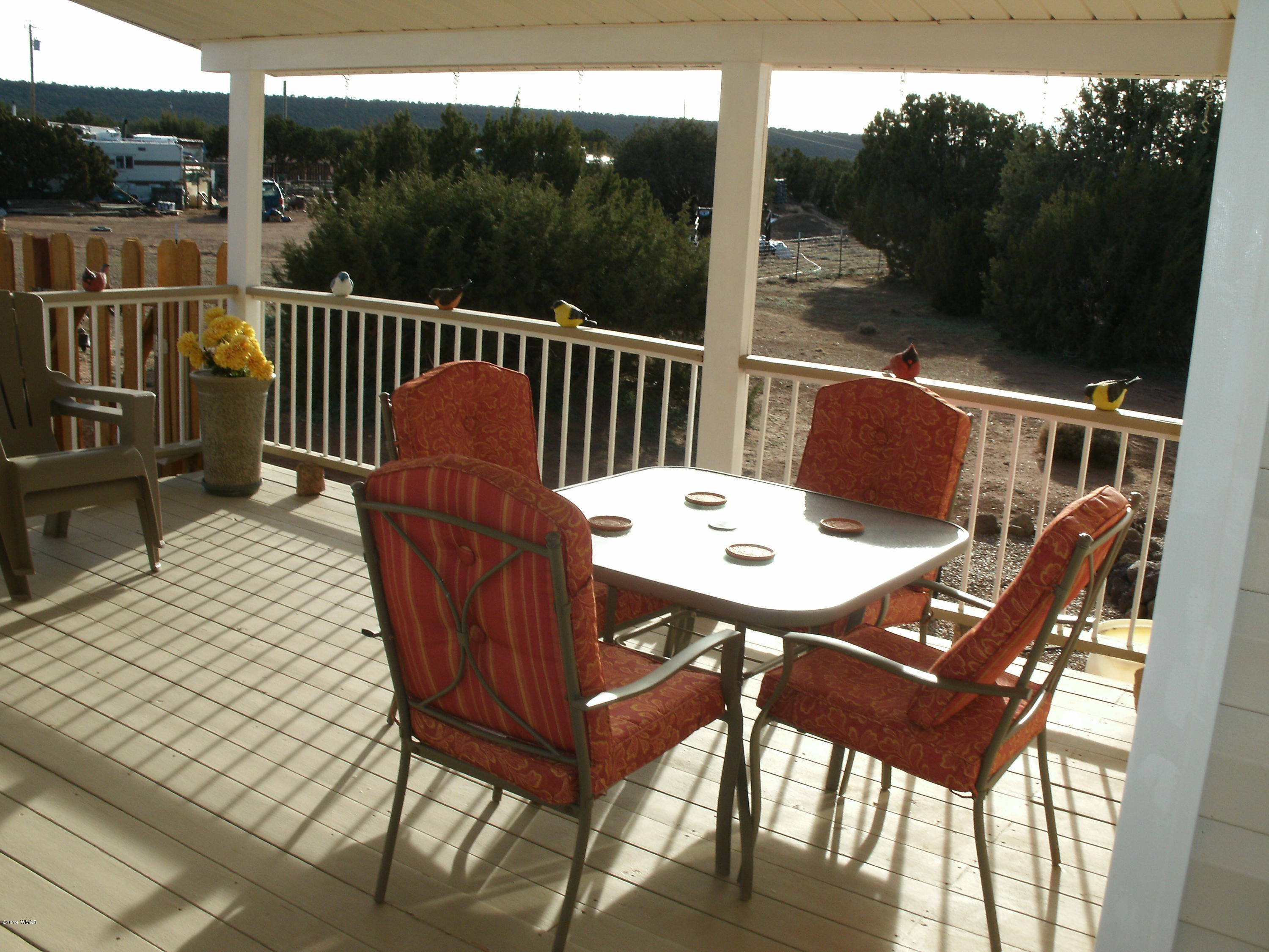 4078 East Pinto Road Snowflake, AZ 85937 - Photo 14 of 49 a view of a chairs and table on the deck