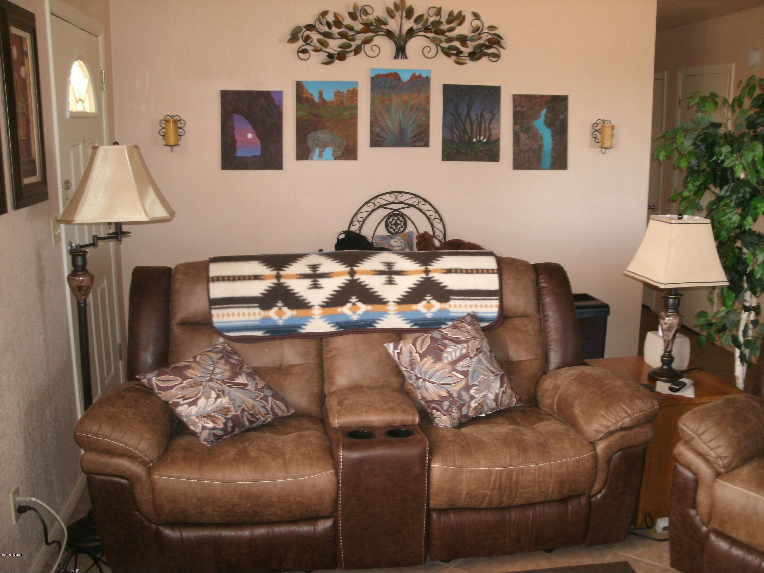 4078 East Pinto Road Snowflake, AZ 85937 - Photo 18 of 49 a living room with furniture and a lamp