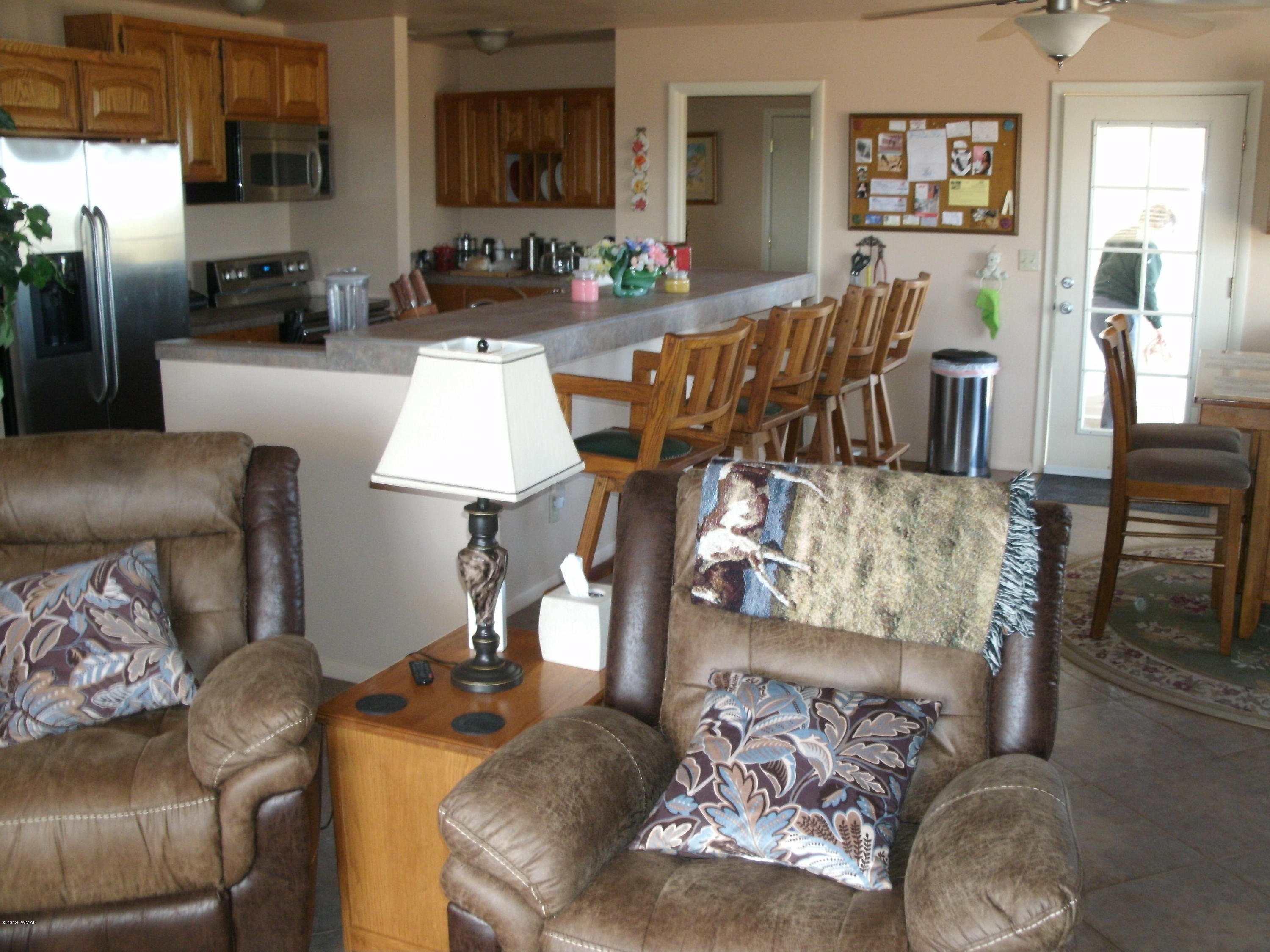 4078 East Pinto Road Snowflake, AZ 85937 - Photo 19 of 49 a living room with furniture and a flat screen tv