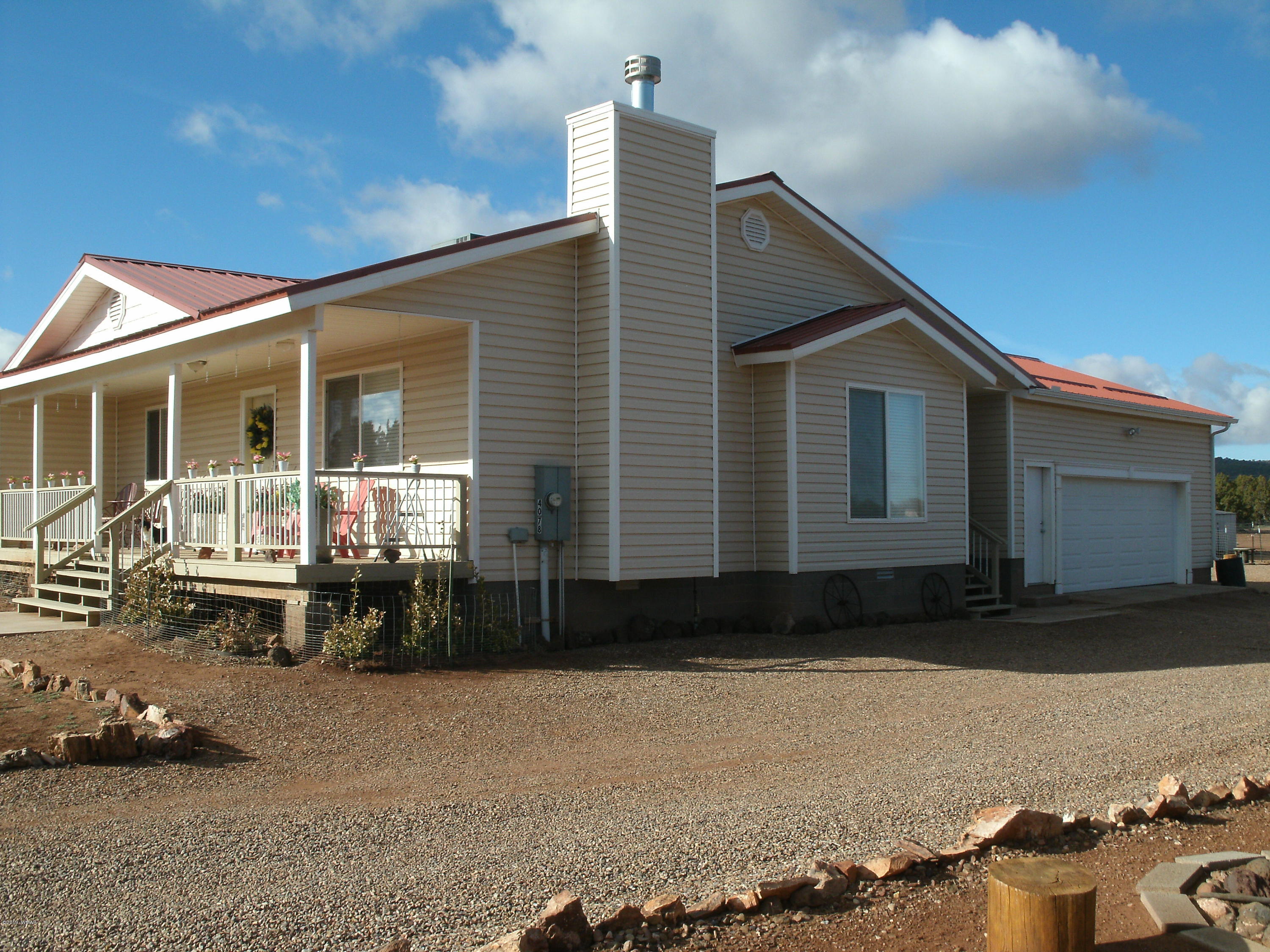 4078 East Pinto Road Snowflake, AZ 85937 - Photo 2 of 49 a front view of a house with a yard