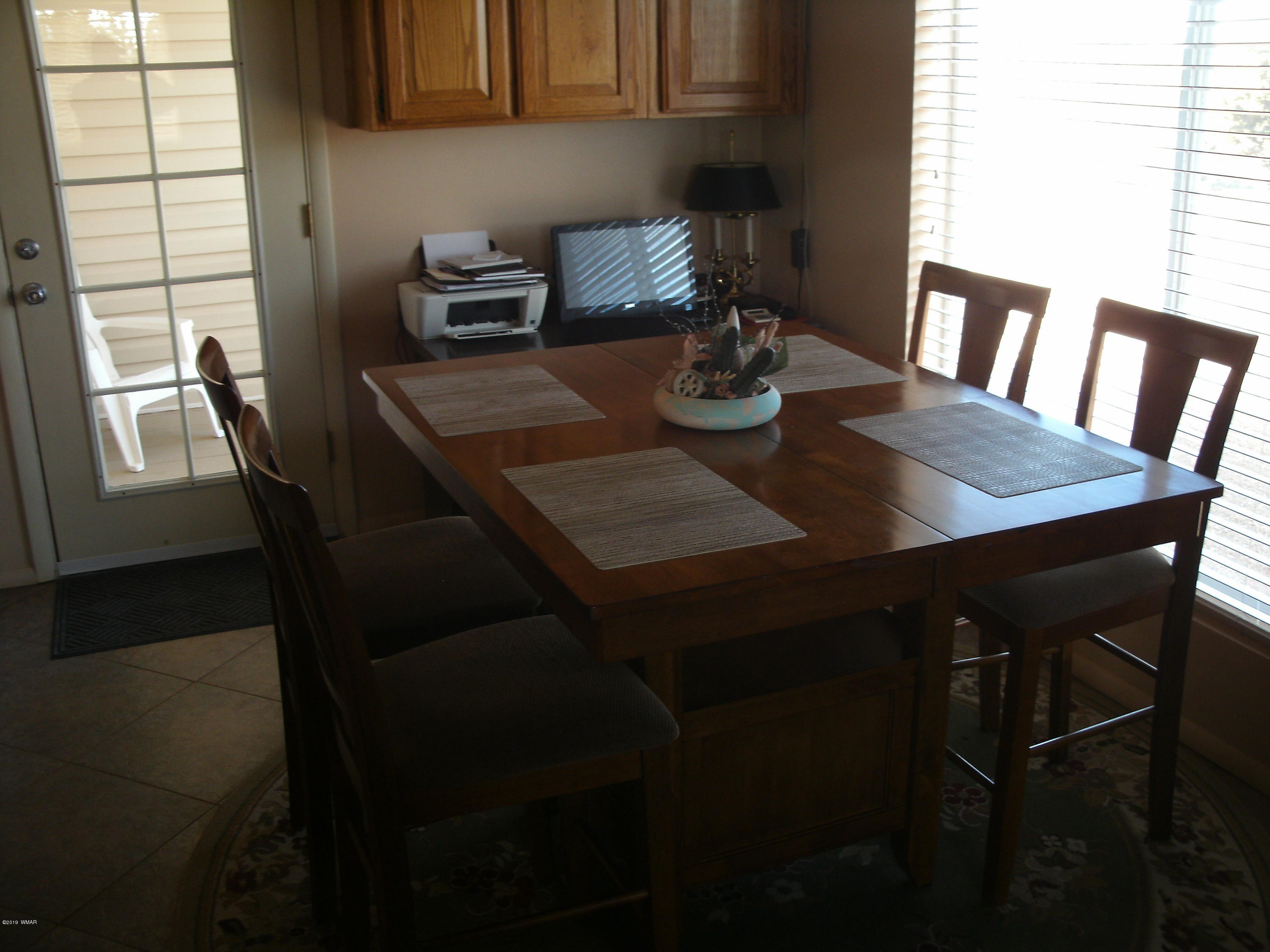 4078 East Pinto Road Snowflake, AZ 85937 - Photo 22 of 49 a view of a dining room with furniture and window