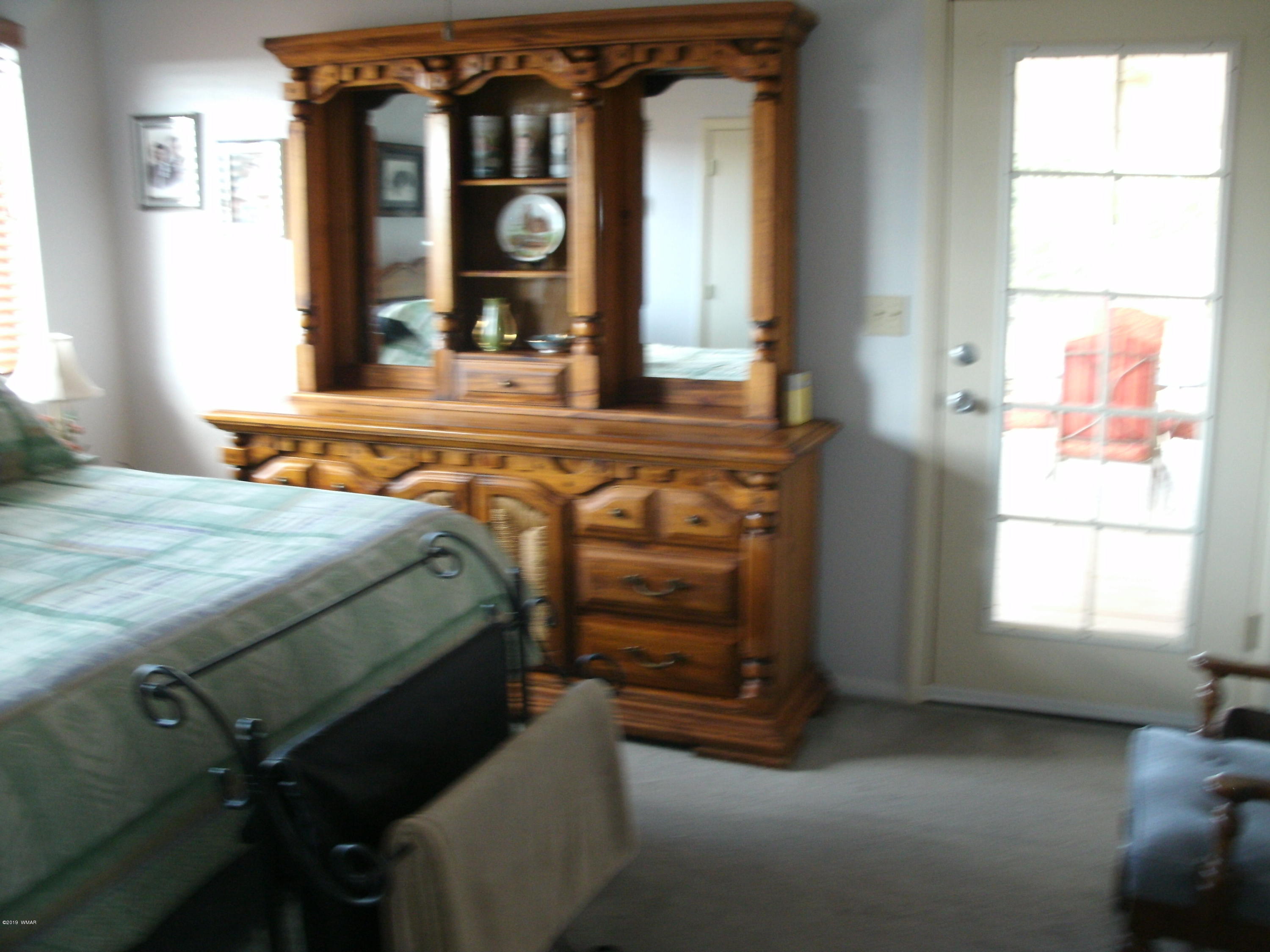 4078 East Pinto Road Snowflake, AZ 85937 - Photo 29 of 49 a bedroom with a bed and a window