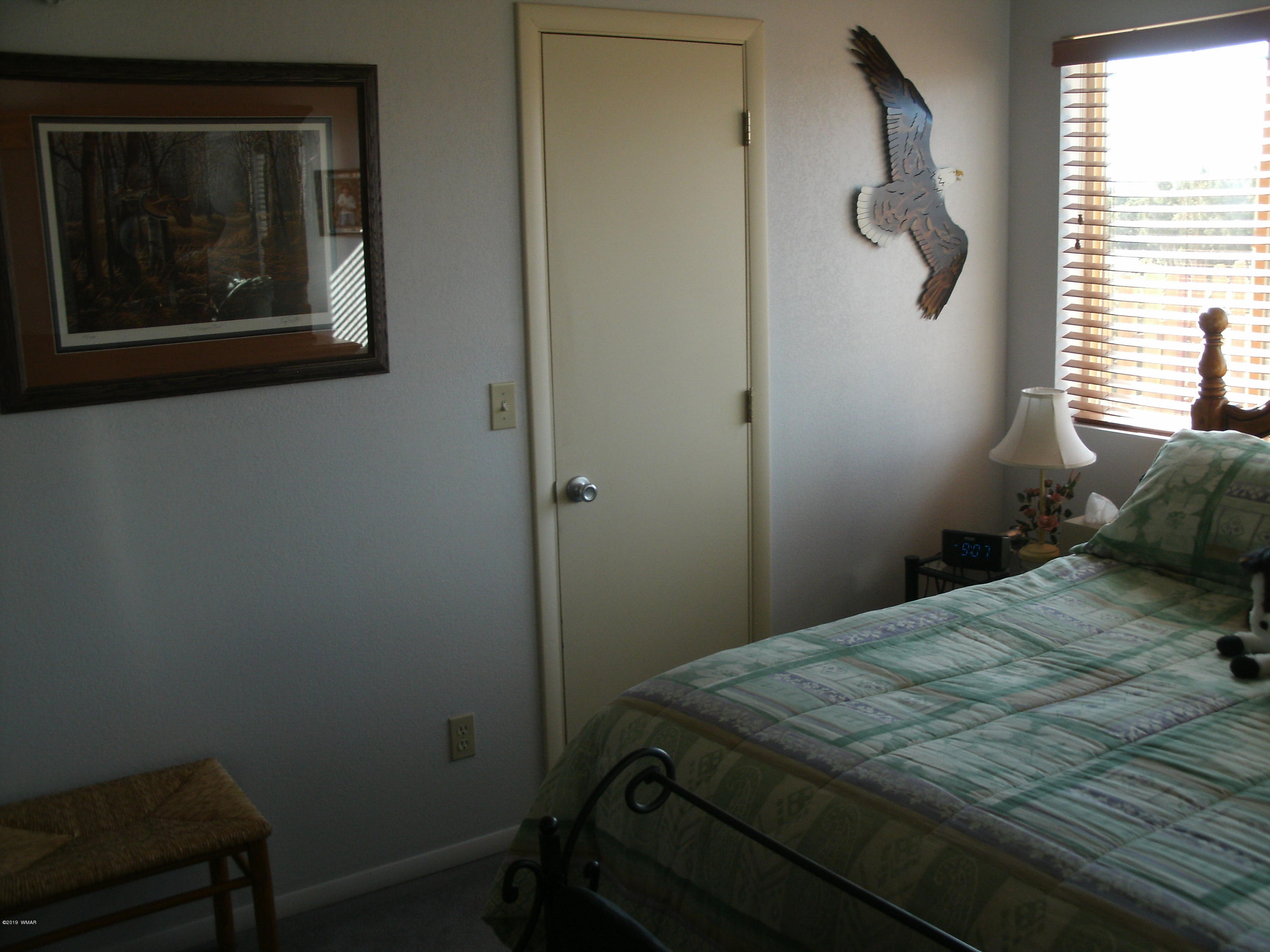4078 East Pinto Road Snowflake, AZ 85937 - Photo 32 of 49 a bedroom with a bed and a window