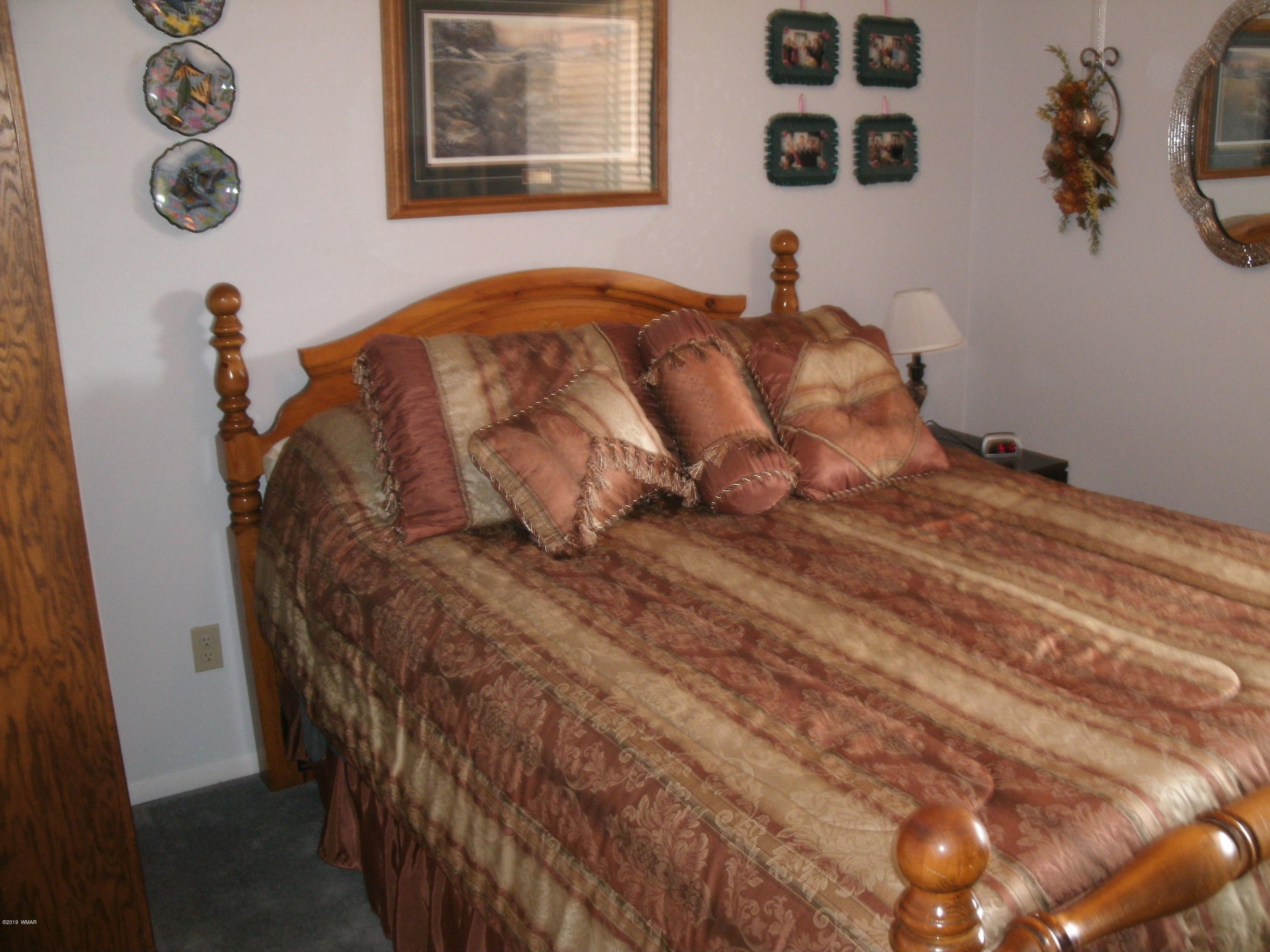 4078 East Pinto Road Snowflake, AZ 85937 - Photo 33 of 49 a bedroom with a bed and a wall painting