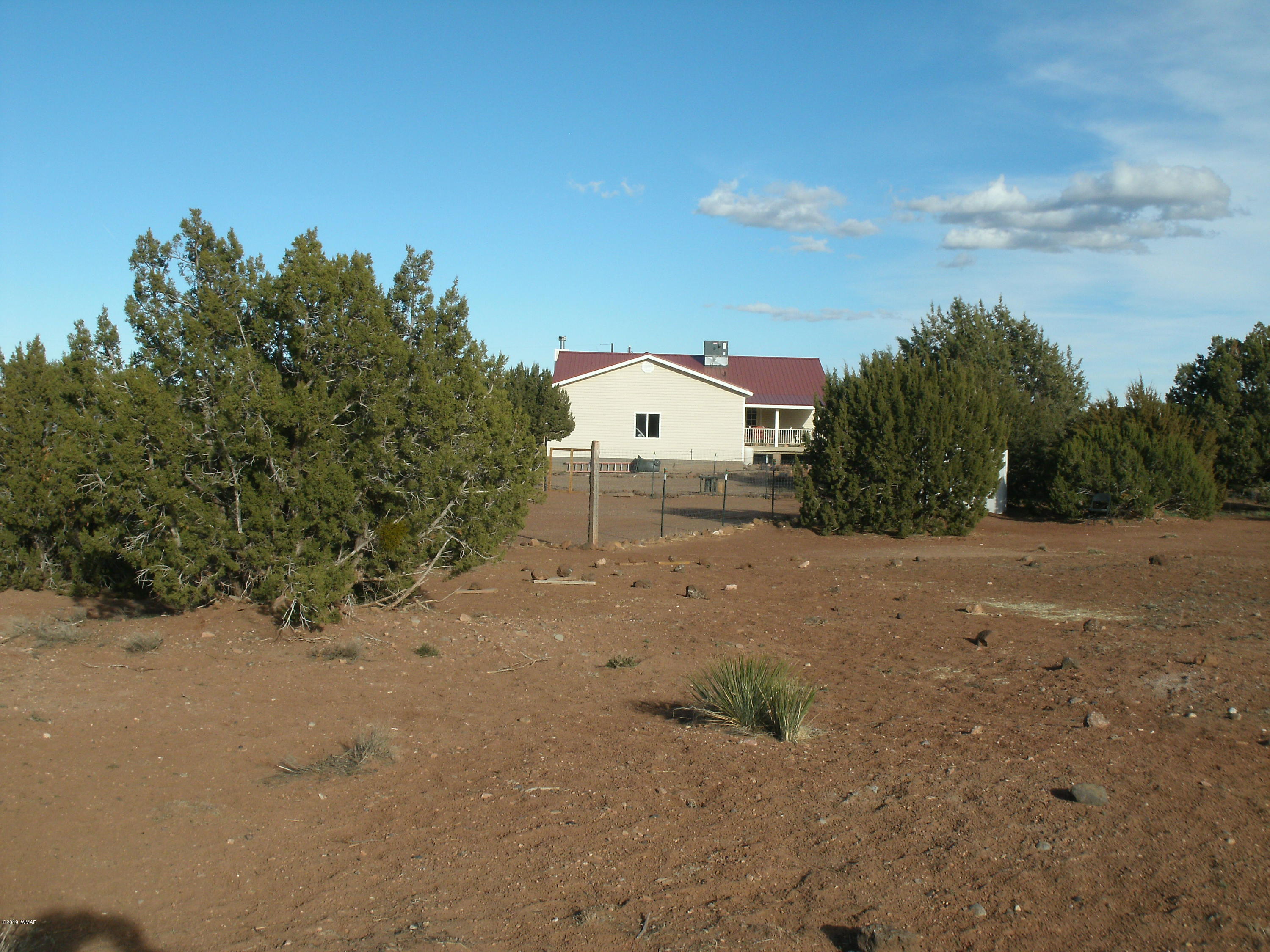 4078 East Pinto Road Snowflake, AZ 85937 - Photo 46 of 49 a backyard of a house with large trees and outdoor space