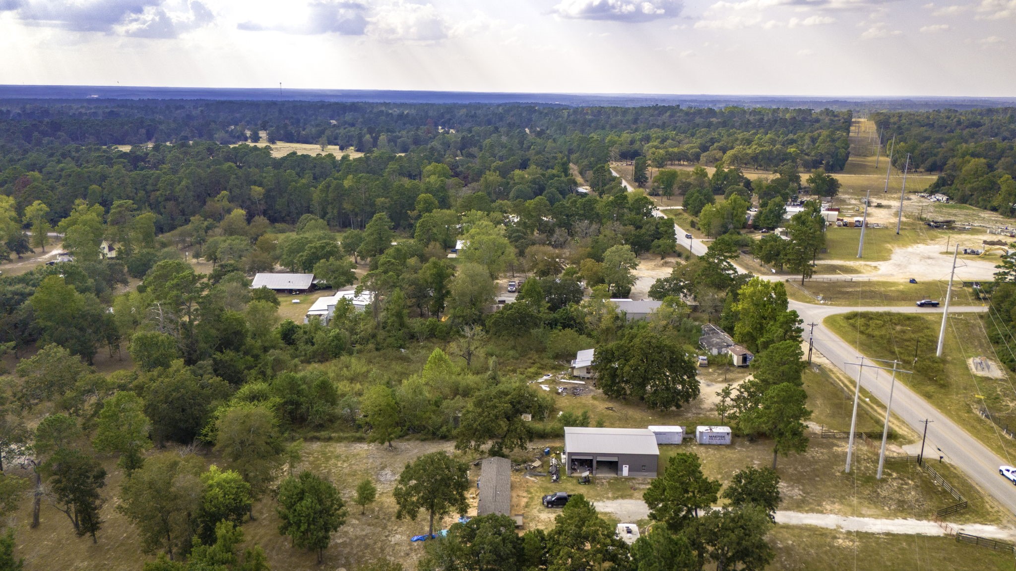 19791 Keenan Cut Off Road Montgomery, TX 77316 - Photo 21 of 41 an aerial view of residential houses with outdoor space and trees