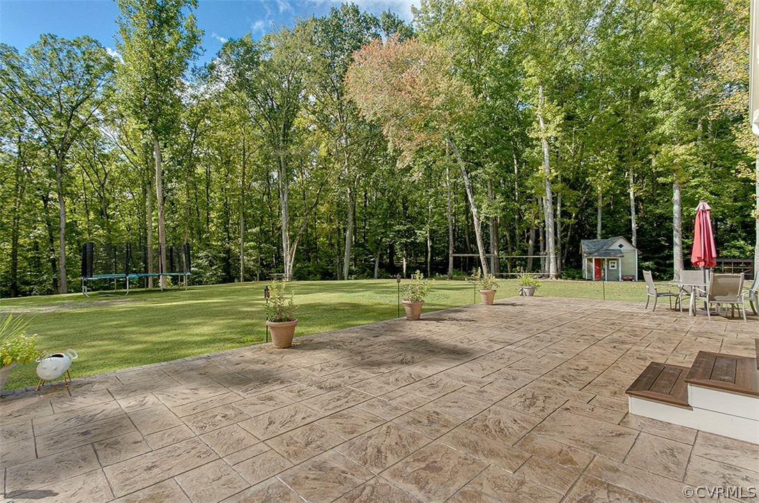 11047 Cross Corner Road Ashland, VA 23005 - Photo 33 of 47 This rear stamped concrete patio is amazing!