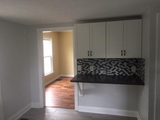 95 Community Road, Unit APPT 2 Pinehurst, NC 28374 - Photo 11 of 16 Refurbished kitchen looking through to living room