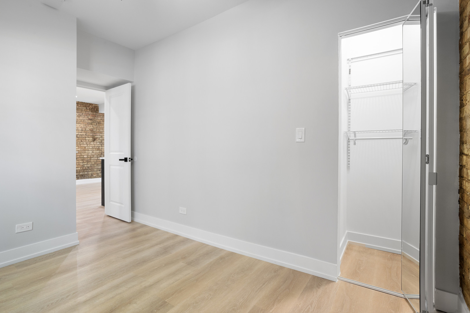 1552 West Juneway Terrace, Unit 3E Chicago, IL 60626 - Photo 10 of 13 an empty room with wooden floor