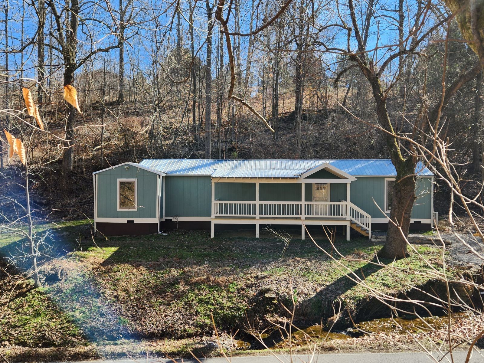 2179 Hackney Road Greenbrier, TN 37073 - Photo 1 of 20 a house with trees in front of it