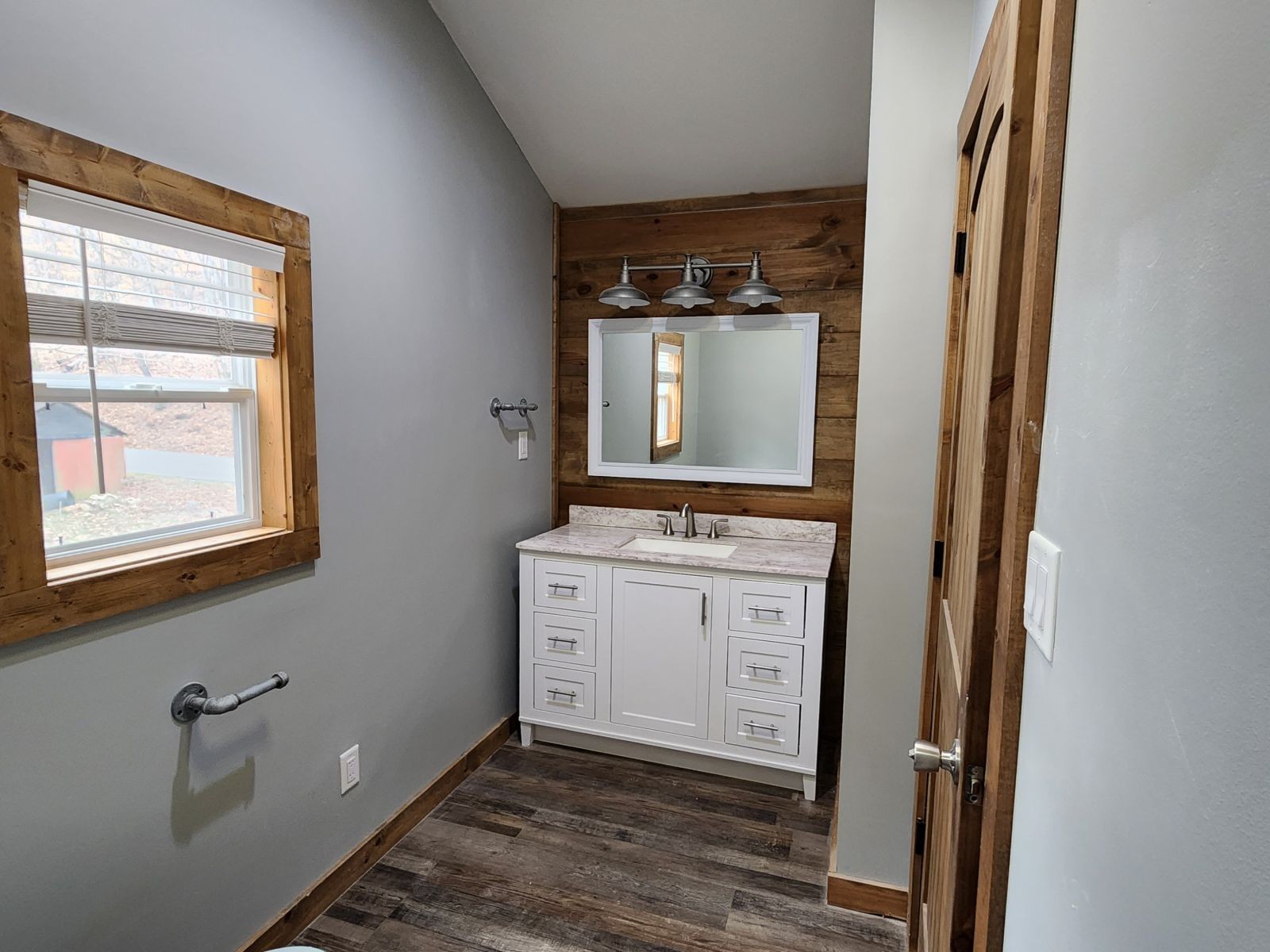 2179 Hackney Road Greenbrier, TN 37073 - Photo 14 of 20 a bathroom with a sink a mirror and a window