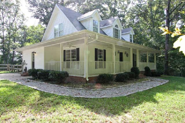 7584 Crow Cut Road Fairview, TN 37062 - Photo 2 of 20 Side view of this cozy cottage. Notice the surroundings and beautiful trees that provide the privacy of this home.