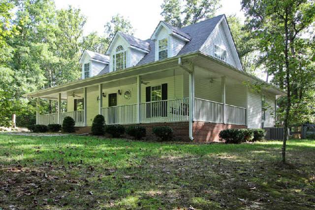7584 Crow Cut Road Fairview, TN 37062 - Photo 3 of 20 When you dream about a house in the woods, this is what it looks like! Wraparound porch with a wooden swing! Wow!