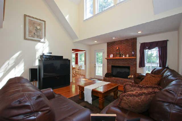 7584 Crow Cut Road Fairview, TN 37062 - Photo 6 of 20 Great room with lots of light from upper and lower windows..Brick fireplace and hardwood floors. Easily accessible from kitchen for snacking during ballgames, movies, etc. Plenty of room for all of your family and friends!