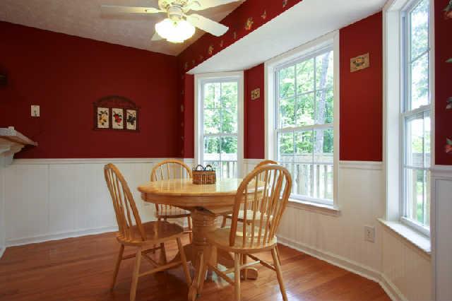 7584 Crow Cut Road Fairview, TN 37062 - Photo 10 of 20 Closer view of eating space in kitchen showing beautiful beadboard wainscoting and view of completely fenced backyard and wooden deck. Imagine this view on a snowy morning...