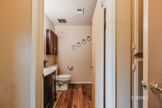 543 South Fairview Street Ridgecrest, CA 93555 - Photo 18 of 38 a bathroom with a toilet and a shower