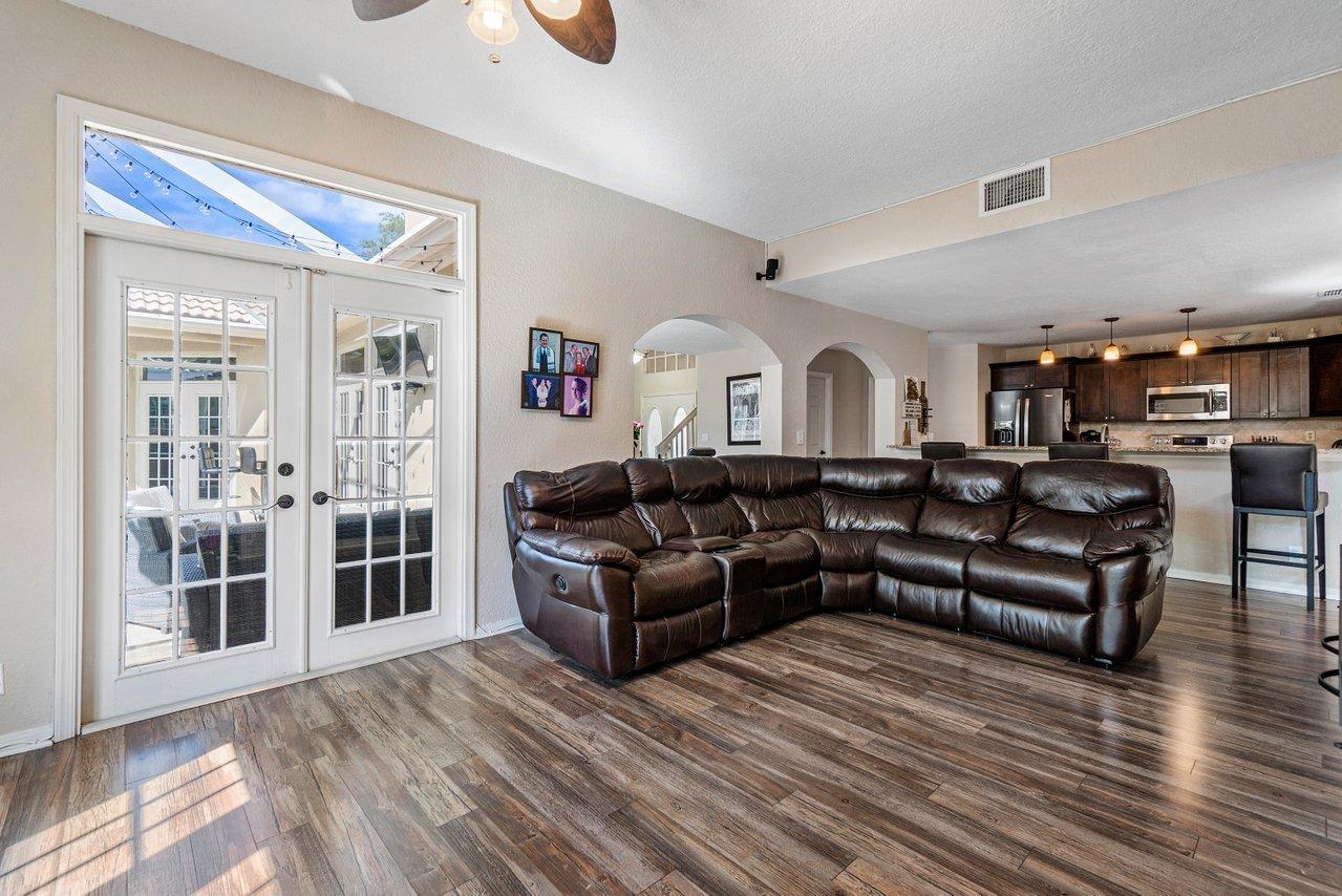 10921 Haydn Drive Boca Raton, FL 33498 - Photo 16 of 45 a living room with furniture and a wooden floor