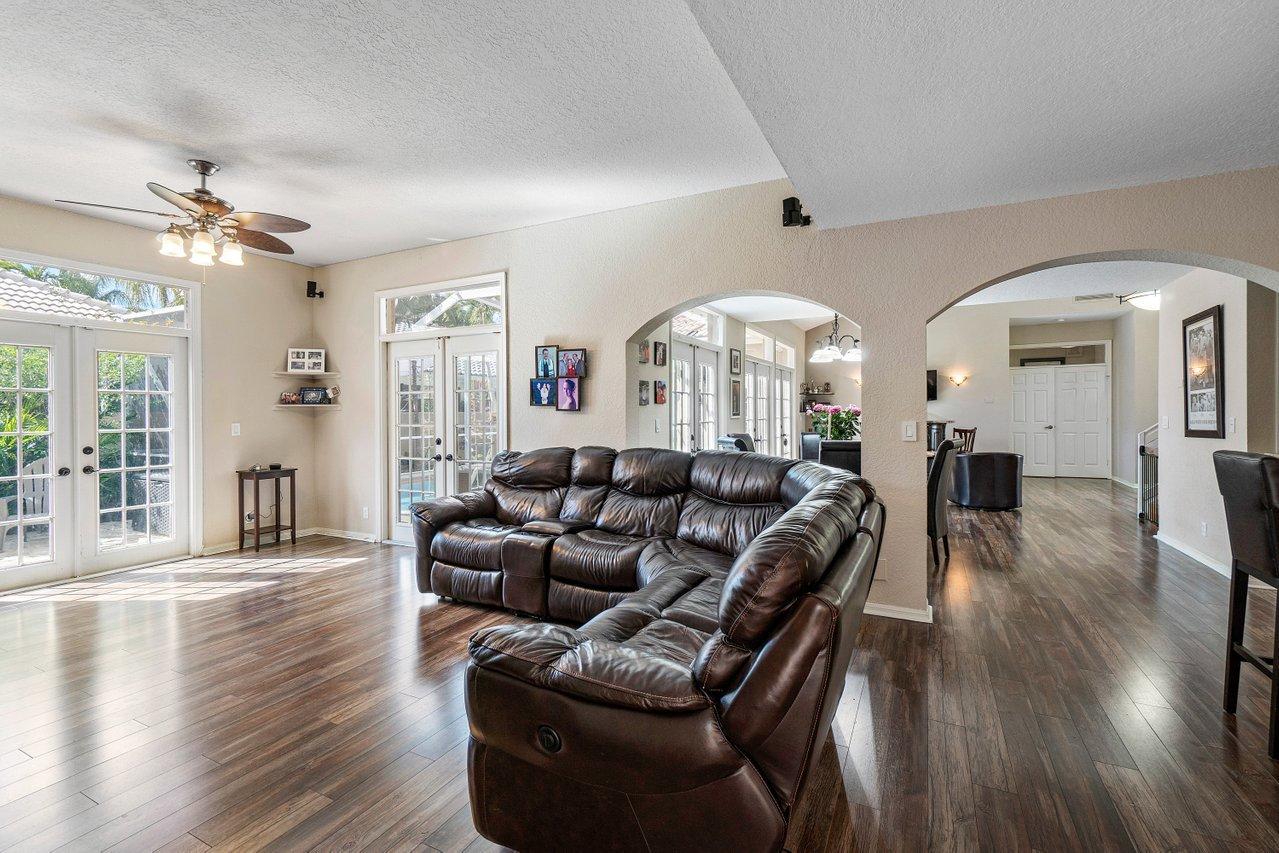 10921 Haydn Drive Boca Raton, FL 33498 - Photo 17 of 45 a living room with furniture and wooden floor