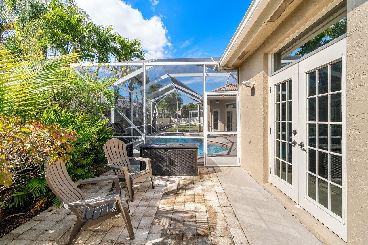 10921 Haydn Drive Boca Raton, FL 33498 - Photo 23 of 45 a view of an chairs and tables in the balcony