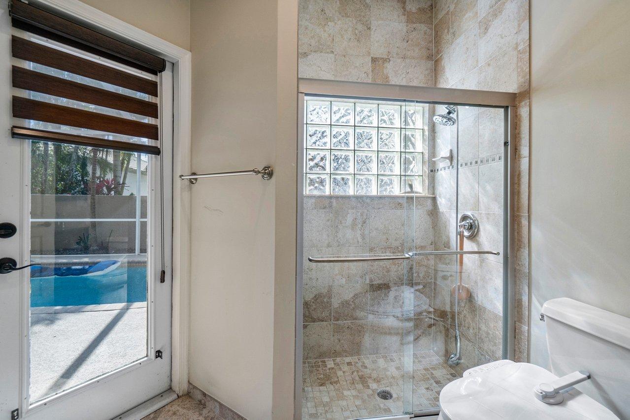 10921 Haydn Drive Boca Raton, FL 33498 - Photo 25 of 45 a bathroom with a toilet and a shower
