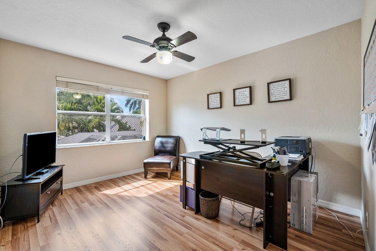 10921 Haydn Drive Boca Raton, FL 33498 - Photo 31 of 45 a view of a workspace with furniture and a window