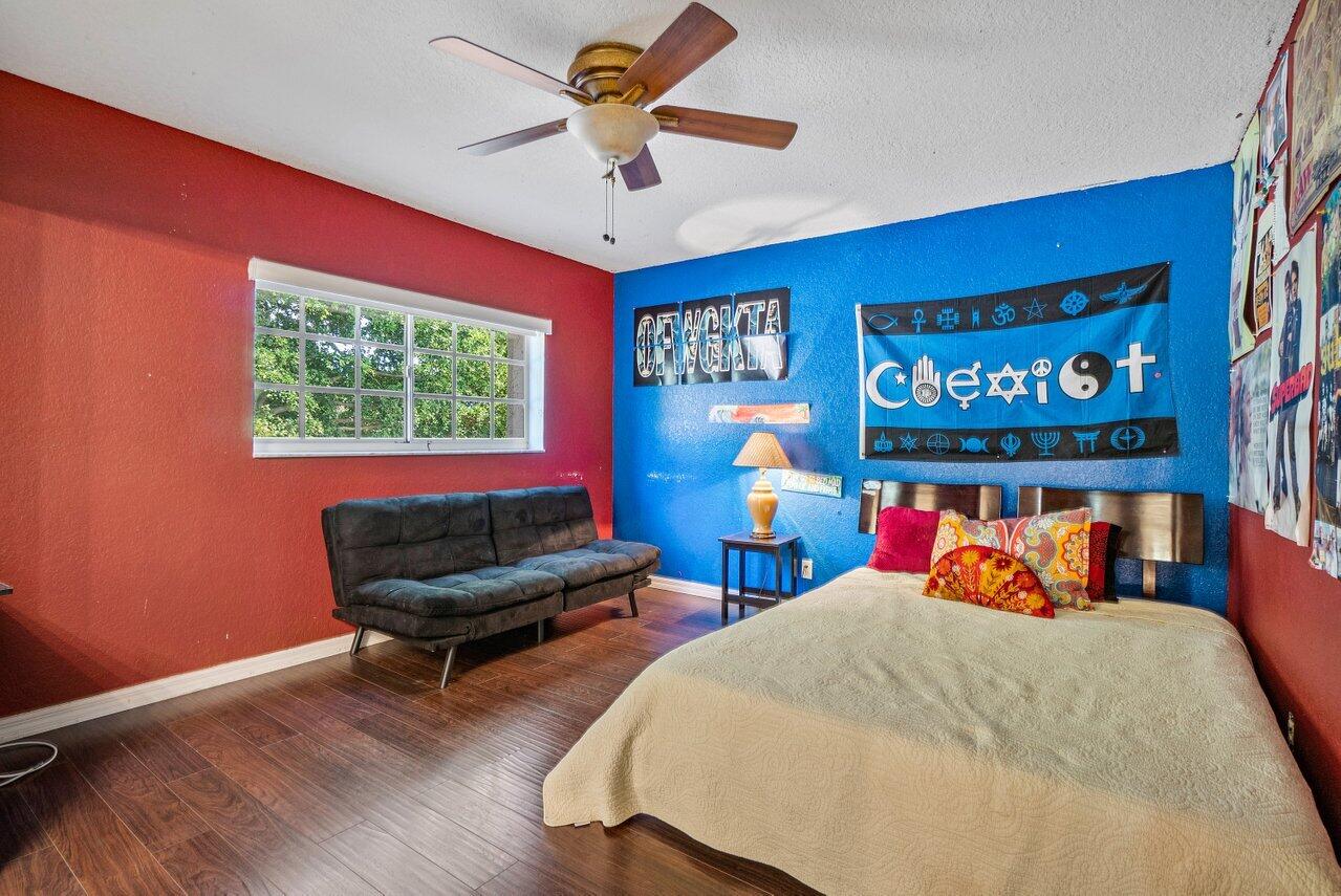 10921 Haydn Drive Boca Raton, FL 33498 - Photo 35 of 45 a bed room with furniture and a window