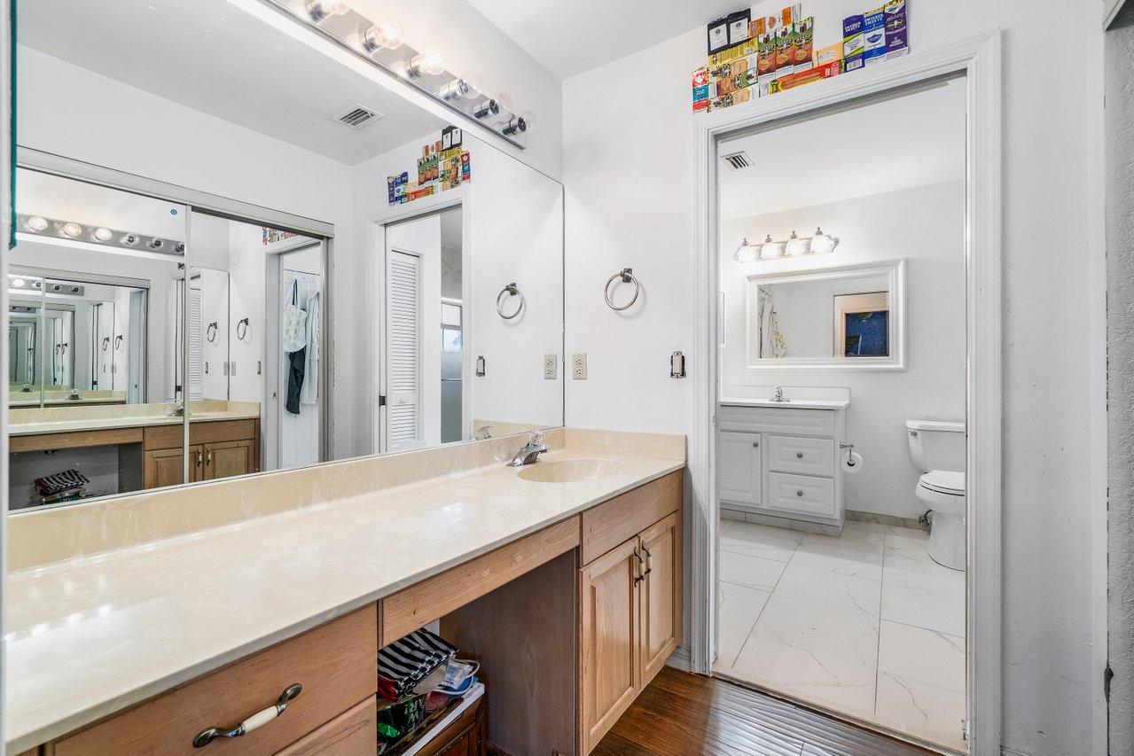 10921 Haydn Drive Boca Raton, FL 33498 - Photo 36 of 45 a en suite bathroom with a sink double vanity