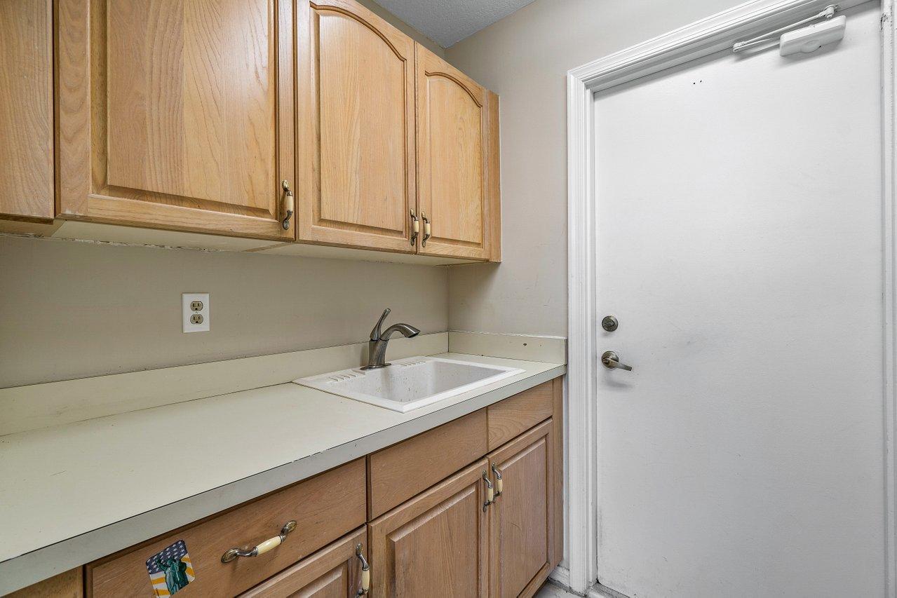 10921 Haydn Drive Boca Raton, FL 33498 - Photo 39 of 45 a kitchen with a sink and cabinets