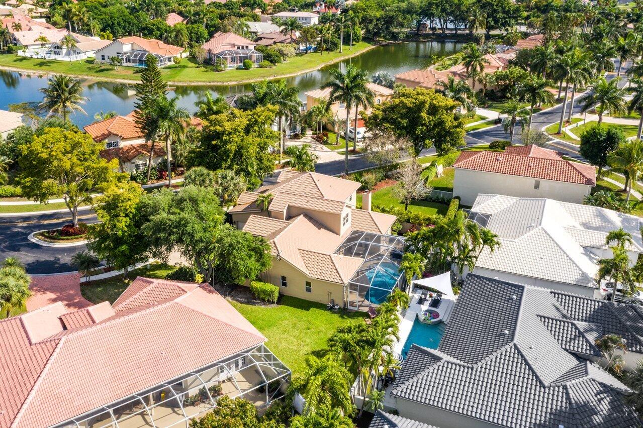 10921 Haydn Drive Boca Raton, FL 33498 - Photo 42 of 45 an aerial view of residential houses with outdoor space and lake view