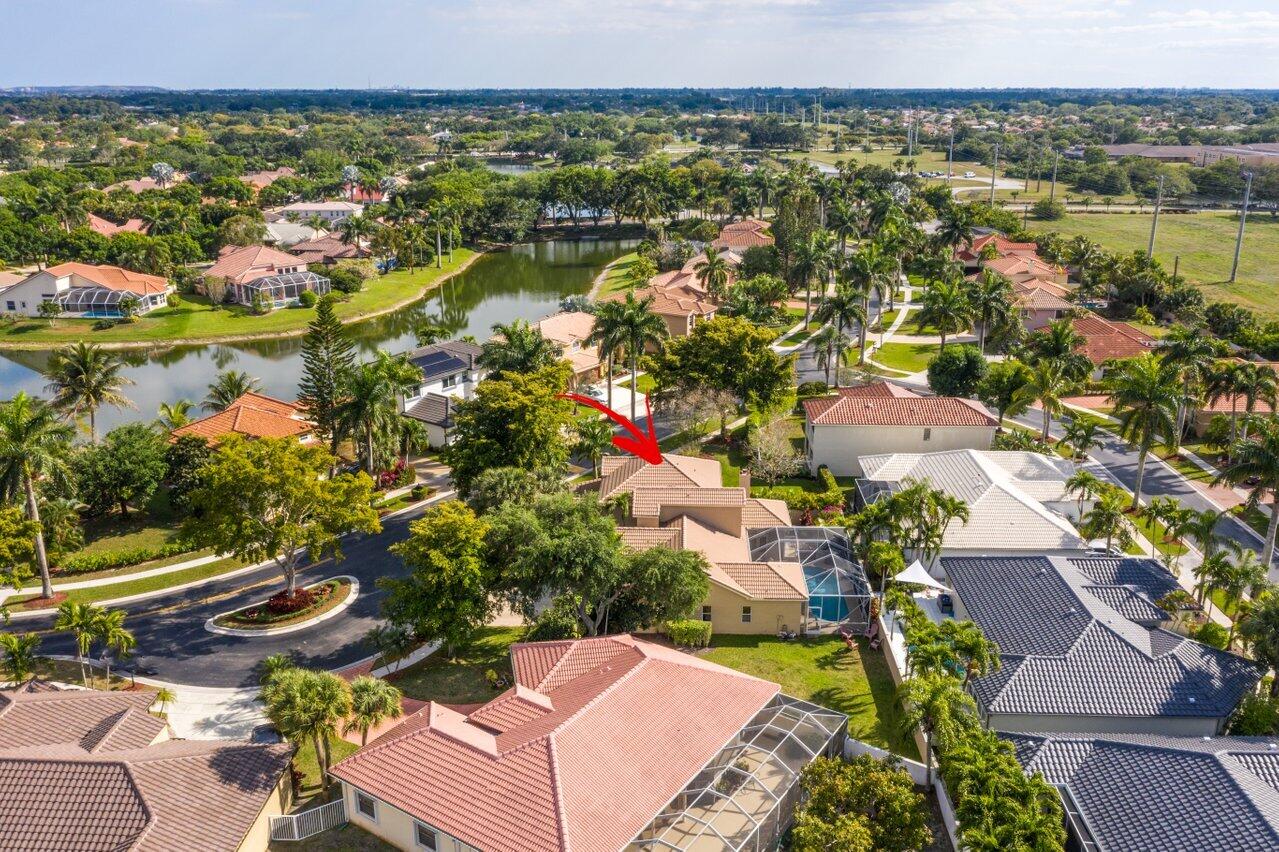 10921 Haydn Drive Boca Raton, FL 33498 - Photo 45 of 45 an aerial view of residential houses with outdoor space and lake view