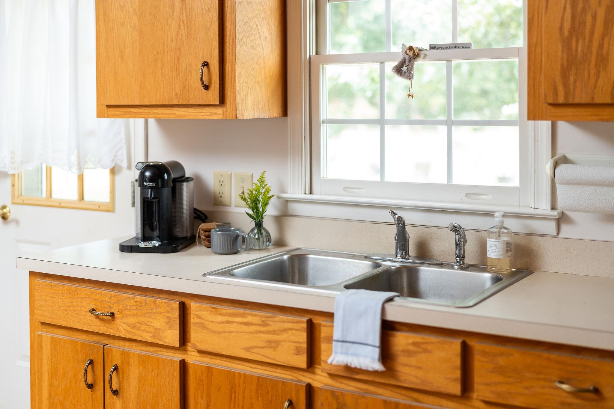 479 Battlefield Road Fort Defiance, VA 24437 - Photo 17 of 51 a kitchen with stainless steel appliances granite countertop a sink and a window