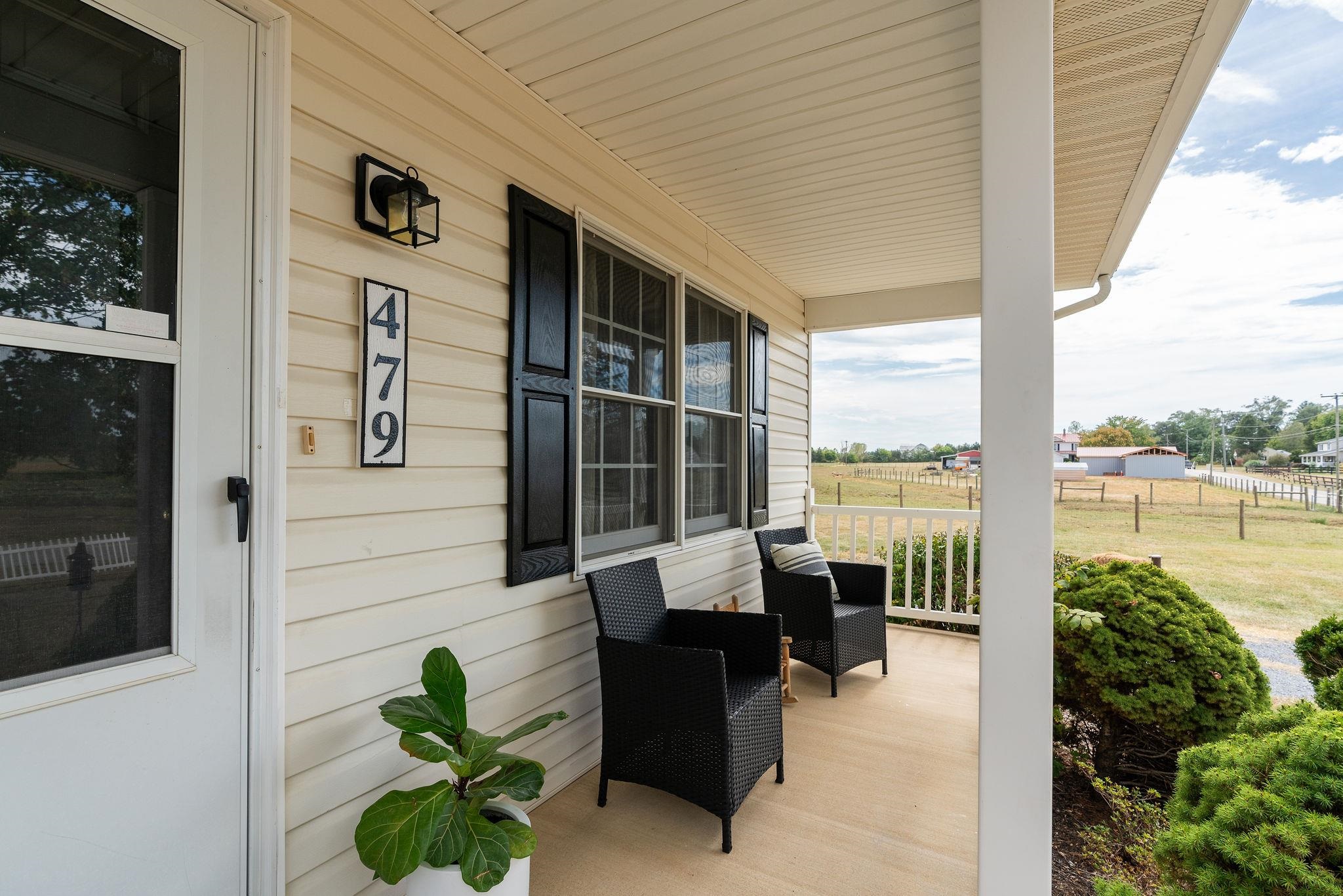 479 Battlefield Road Fort Defiance, VA 24437 - Photo 7 of 51 a balcony with furniture and a potted plant
