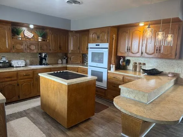 a view of a kitchen and dining room