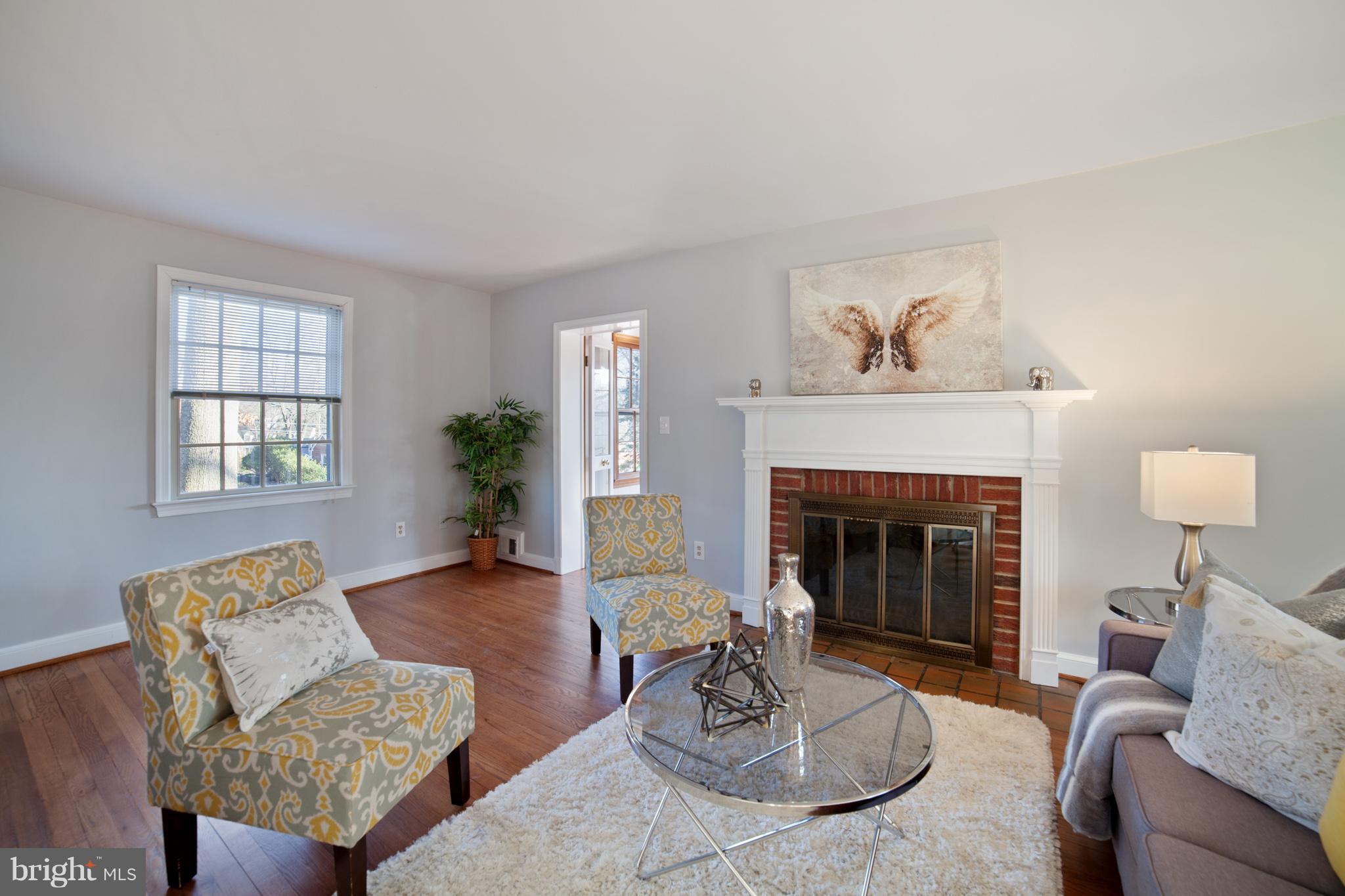 9508 St Andrews Way Silver Spring, MD 20901 - Photo 3 of 30 Living room with wood-burning fireplace