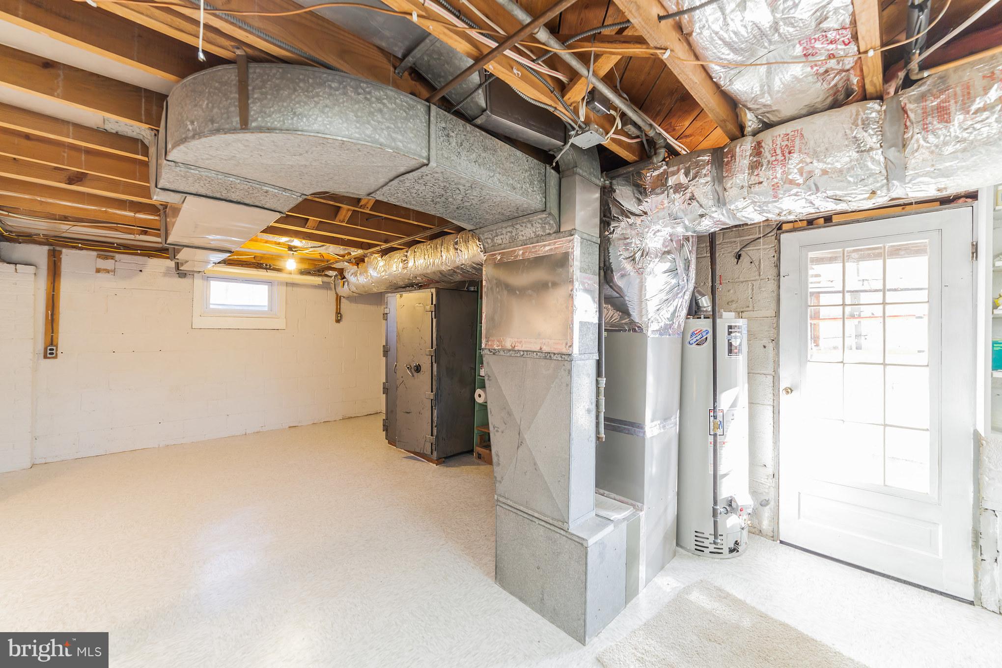 9508 St Andrews Way Silver Spring, MD 20901 - Photo 27 of 30 Basement utility room with door to garage