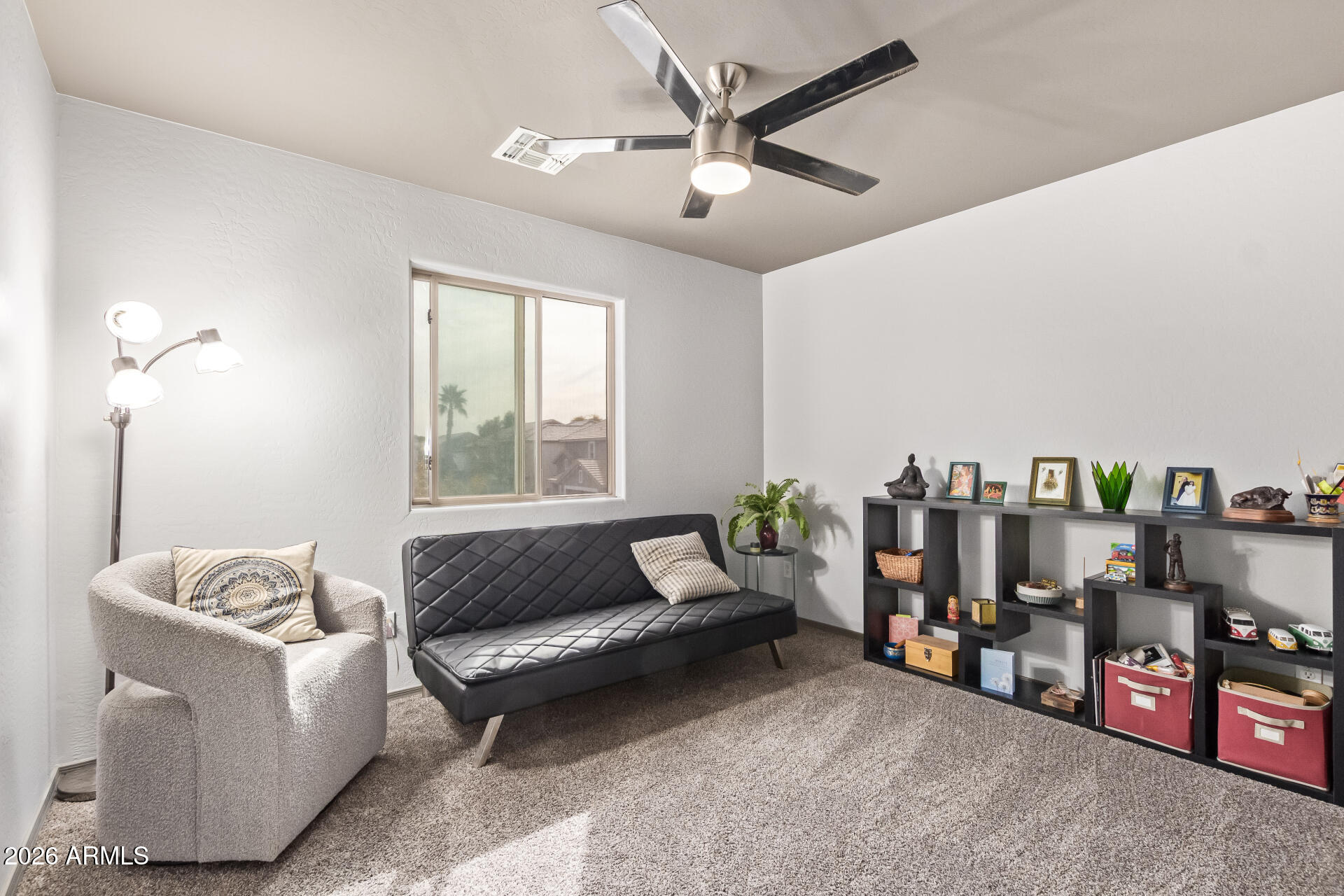 22838 South Legends Road Queen Creek, AZ 85142 - Photo 15 of 22 a living room with furniture and a window