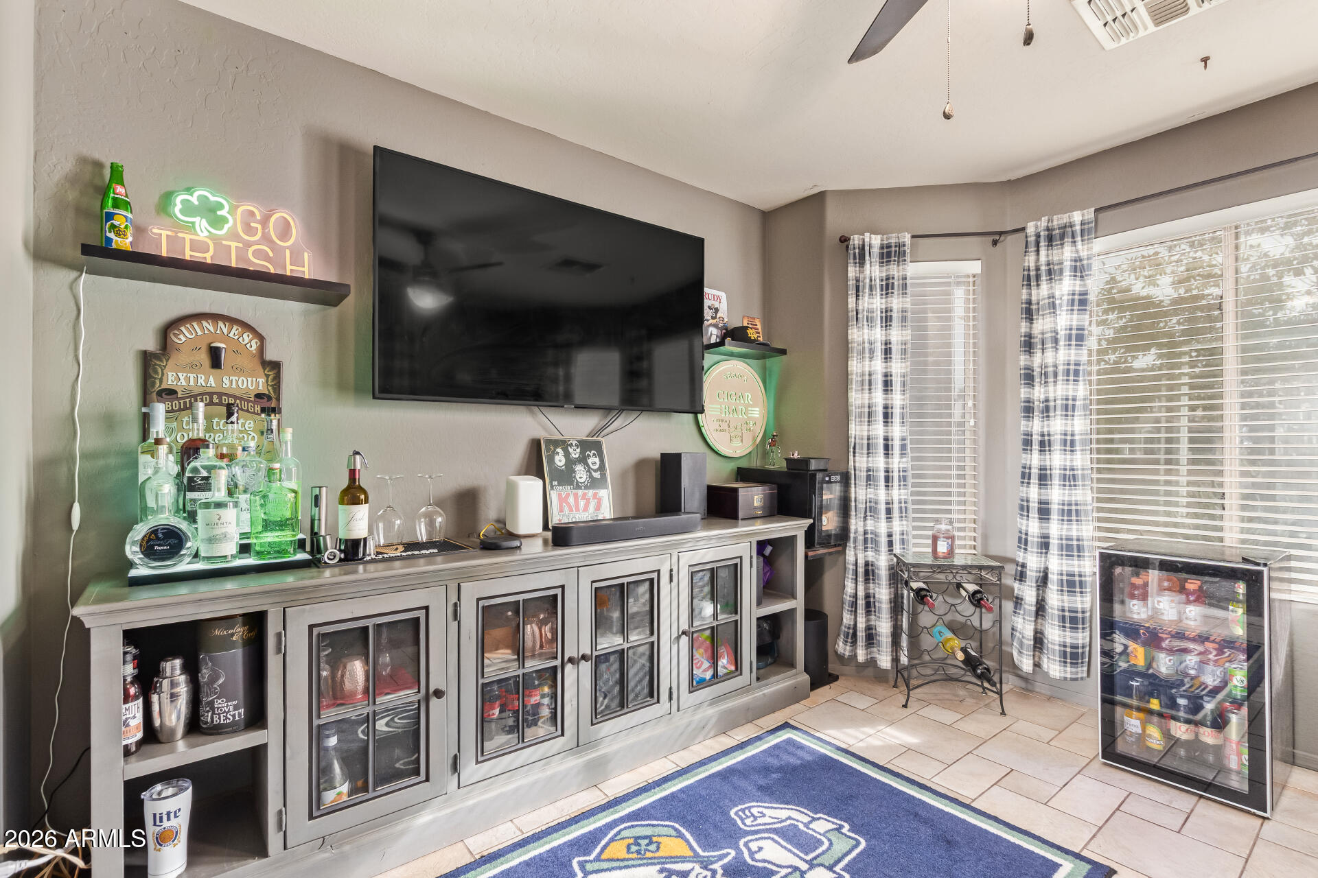 22838 South Legends Road Queen Creek, AZ 85142 - Photo 17 of 22 a living room with furniture and a flat screen tv