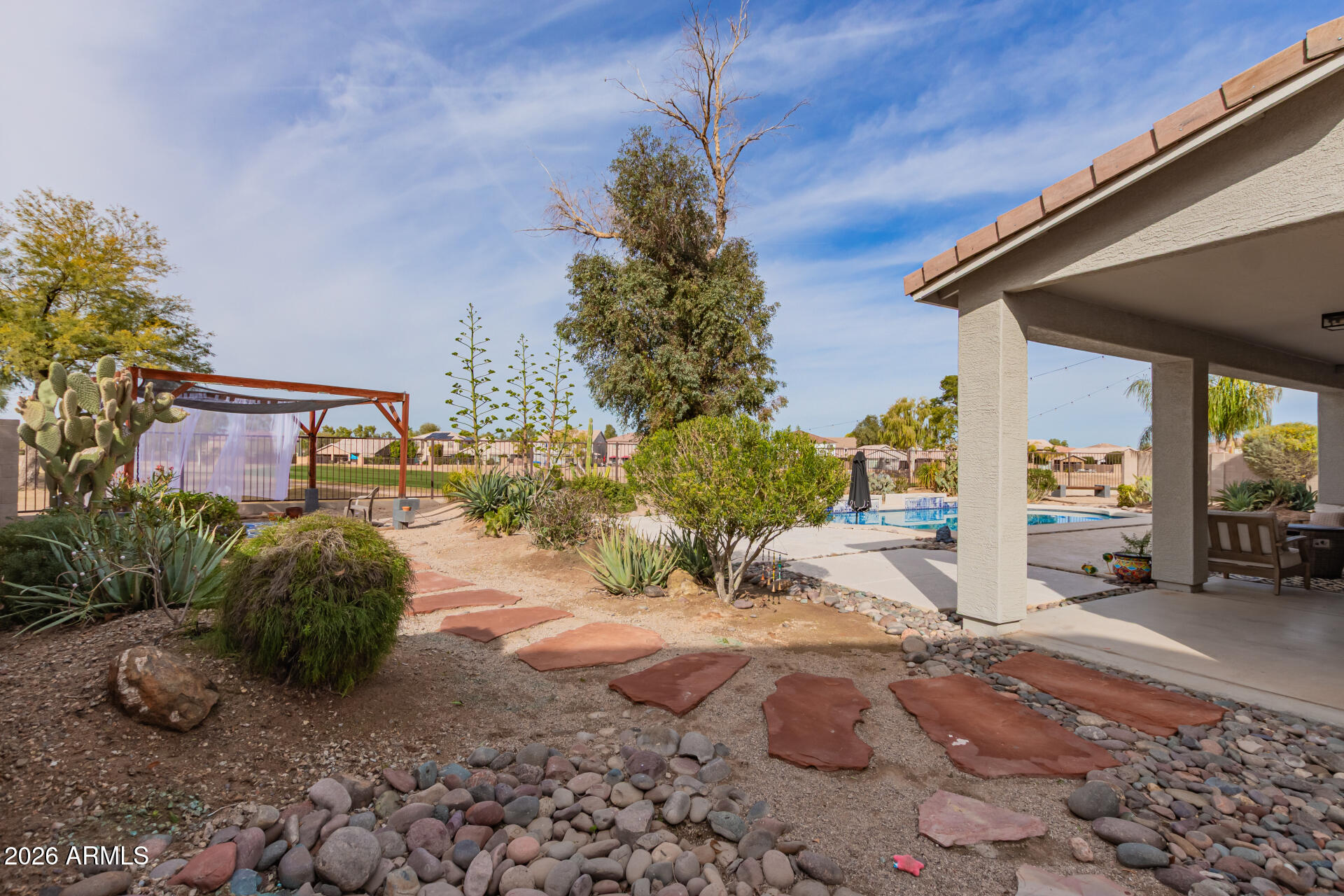 22838 South Legends Road Queen Creek, AZ 85142 - Photo 20 of 22 a row of palm trees in front of a house