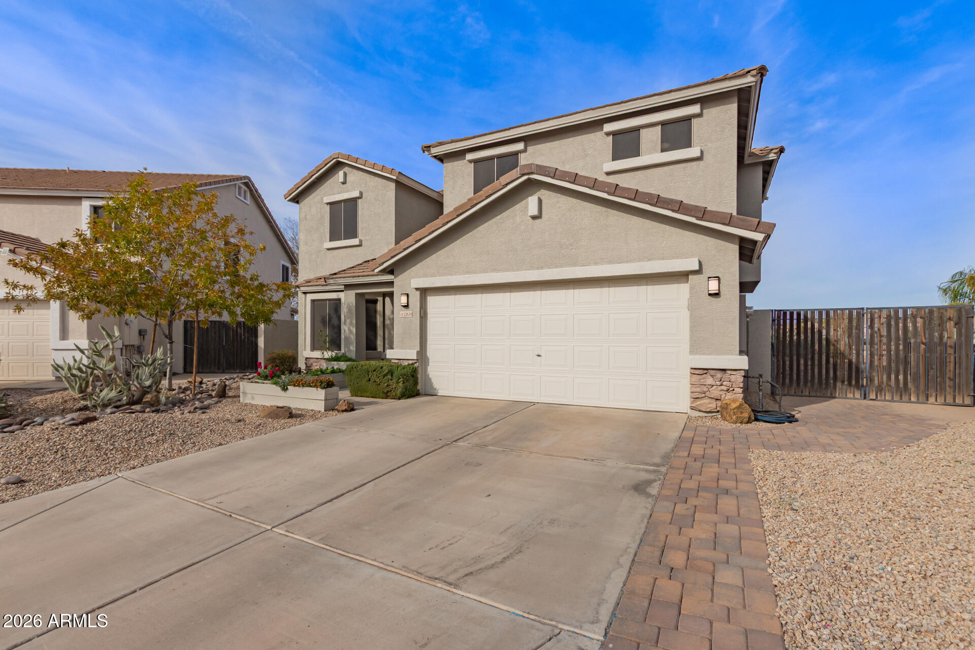 22838 South Legends Road Queen Creek, AZ 85142 - Photo 2 of 22 a view of a house with a yard and garage
