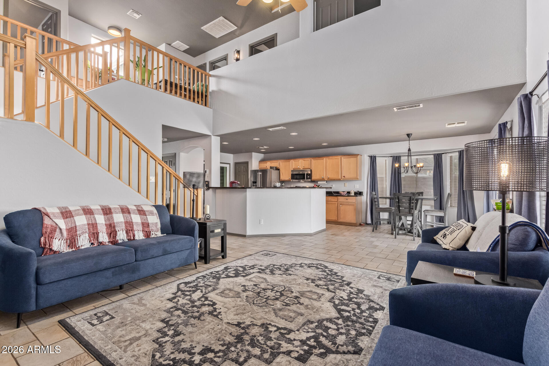 22838 South Legends Road Queen Creek, AZ 85142 - Photo 6 of 22 a living room with furniture and a rug