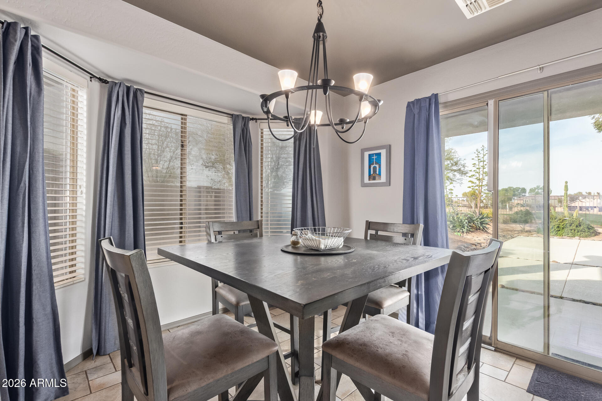 22838 South Legends Road Queen Creek, AZ 85142 - Photo 7 of 22 a view of a dining room with furniture window and outside view