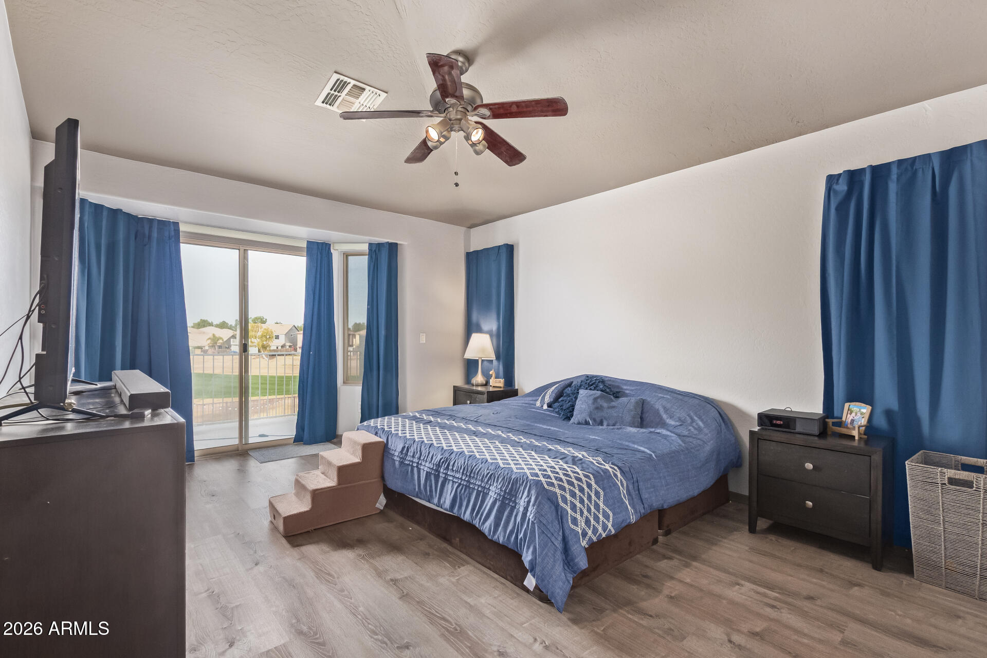 22838 South Legends Road Queen Creek, AZ 85142 - Photo 9 of 22 a bedroom with a bed and window