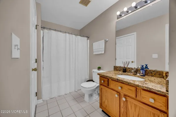 a view of backyard with a table and chairs
