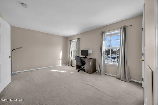 a front view of a house with a fence