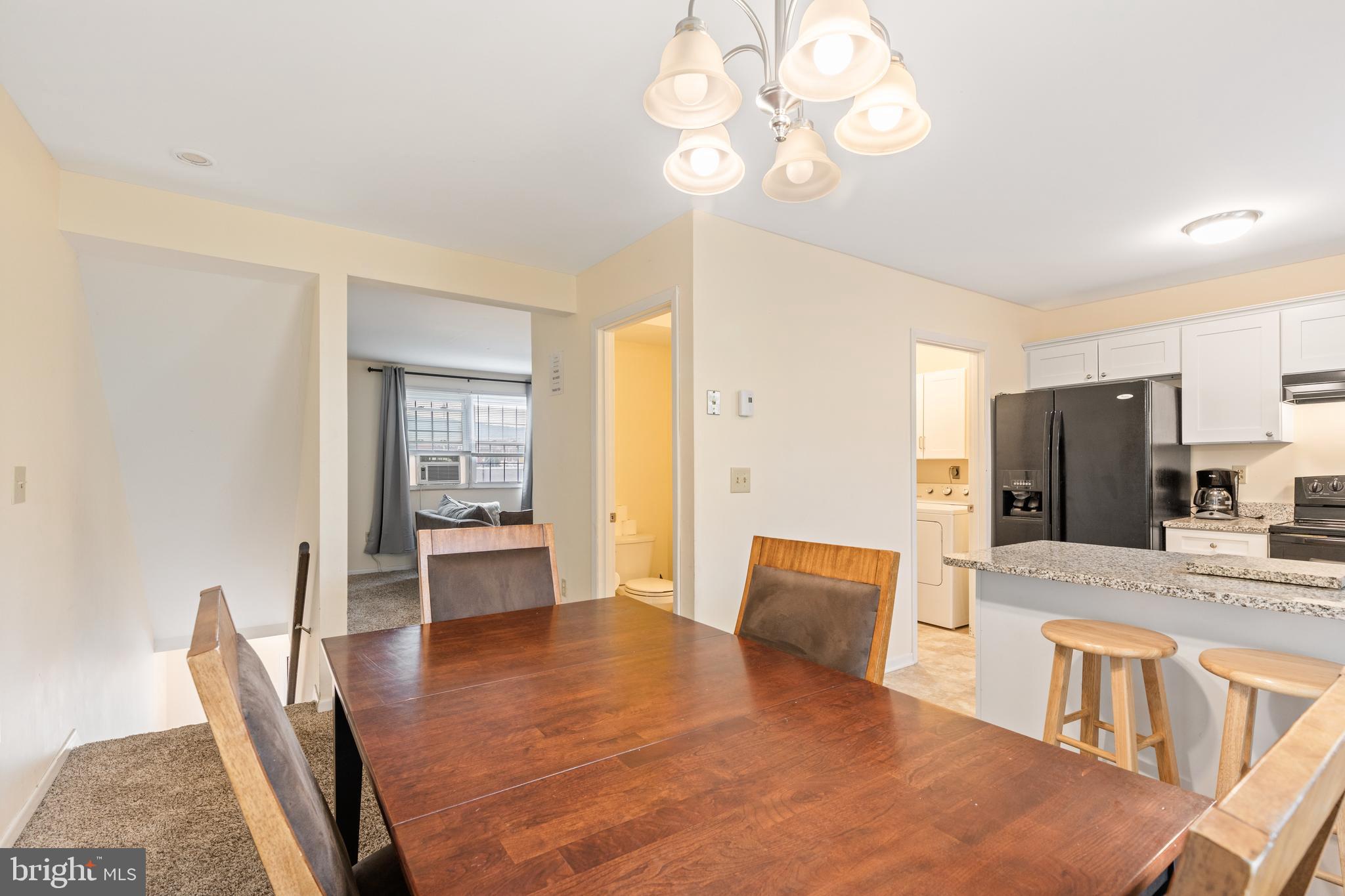276 Broad Street Highspire, PA 17034 - Photo 5 of 28 a large kitchen with a table and chairs